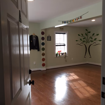 Peeking into the inside of Branches of Yoga studio, through the door.