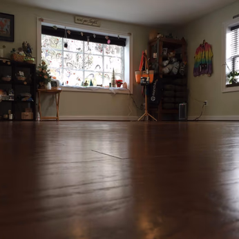 Low shot of the Sykesville yoga studio, beautiful wooden floors.