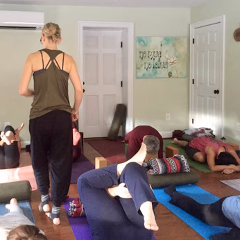 Branches of Yoga, Sykesville, MD teacher walking amongst practitioners