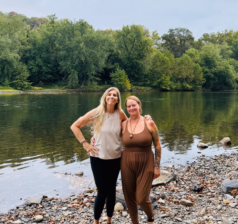A Branches of Yoga teacher sitting down and reading a book.